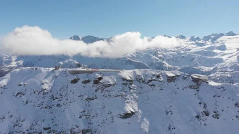 Slow pan around a snowy mountain in the alps in Italy Stock Footage 158443548