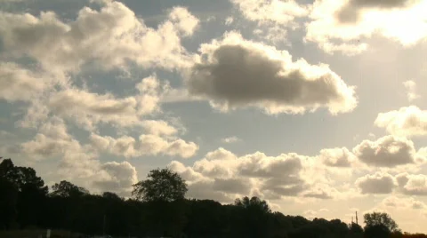 Slow pan of a beautiful partly cloudy sky on a summers day Stock Footage 860913