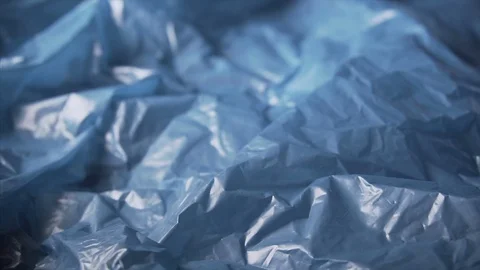 Slow pan of a blue plastic garbage bag, concept of pollution of the environment Video stock 122594133