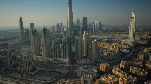 Slow pan up Burj Khalifa while tracking right over Business Bay at 150m. Stock Footage 98945130