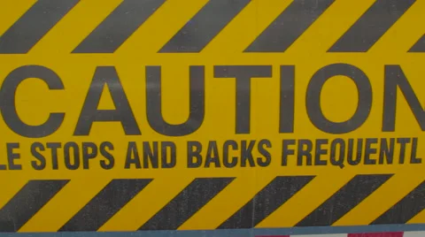 Slow pan of Caution warning sign on rear of freight liner truck Stock-Footage 60037078