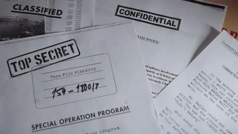 Slow pan on different top secret and classified documents and memos on a desk Stock Footage 199978644
