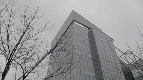 Slow Pan down mirrored office building in fog winter Stock Footage 89945534