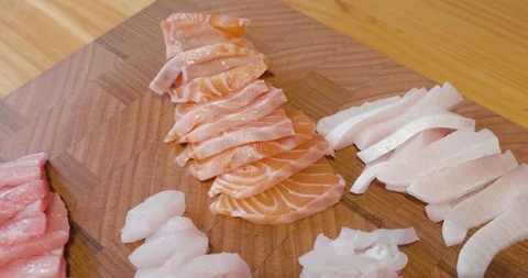 Slow pan down over a beautiful presentation of fresh sliced sashimi fish Stock-Footage 115545272