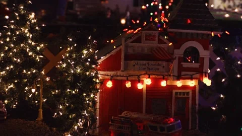 Slow pan down from toy train house to fire station Stock Footage 147988642