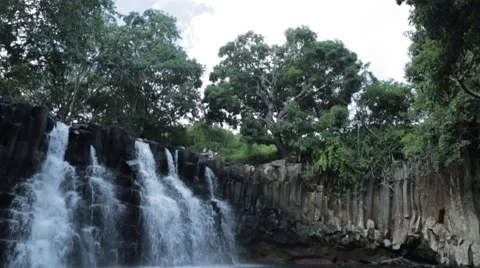 Slow pan down of waterfall in Mauritius Stock Footage 64594468