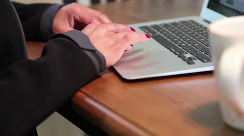 Slow pan: Drinking coffee by laptop 動画素材 40449979