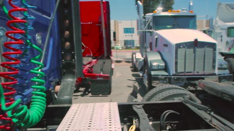 Slow pan of empty bed of freight liner truck to the connecting cables in back Stock-Footage 60031233