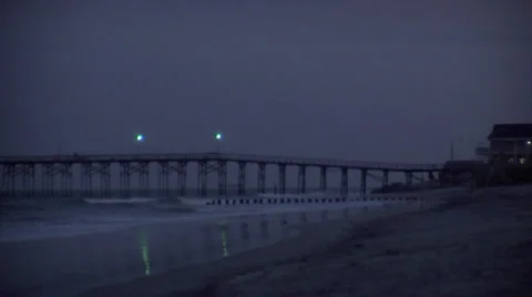 Slow pan off evening pier Stock Footage 24638244