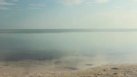 Slow Pan of flat Beach Stock Footage 142610691