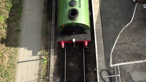 Slow pan focused on the front of a steam train 스톡 동영상 243778542