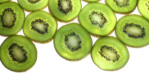 Slow pan of full frame sliced kiwis Stock Footage 46371552