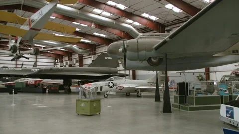 Slow pan inside PIMA Air &amp; Space museum Arizona revealing military airplanes Stock Footage 78490739