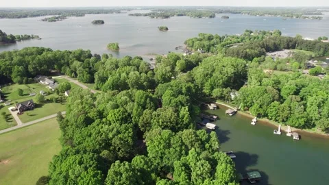 Slow pan of Lake Norman with many boats on a Summer day Stock Footage 308536323