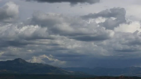 Slow Pan Left across cloudy mountain range, 4K Stock Footage 56465551
