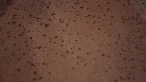 Slow pan up to mountain lake while flying over Nevada desert Stock Footage 89022130