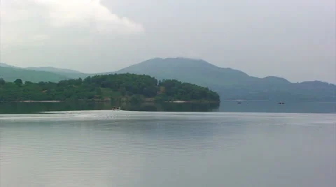 Slow pan on mountain view across the loch Stock Footage 39987595