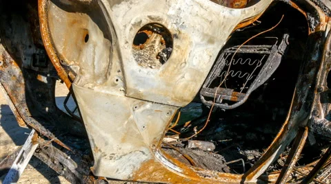Slow pan over destroyed burnt car Stock Footage 54910133