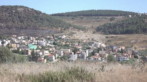 Slow Pan Over Dry Field and City in Distance Stock Footage 78610815