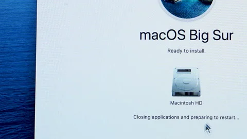 Slow pan over the intro screen of MacOS Big Sur ready to install on the Stock Footage 153400711