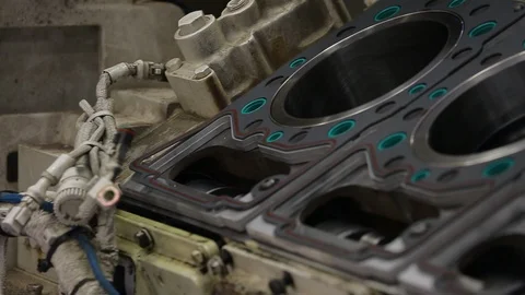 Slow pan over large engine block cylinder head Stock Footage 125833479