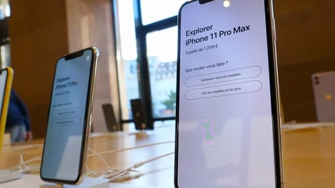 Slow pan over new iPhone 11, 11 Pro and Pro Max are displayed as the smartphone Video stock 126356472