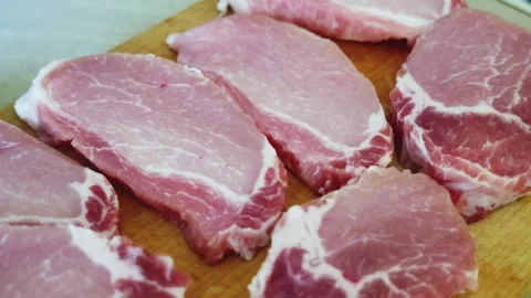 Slow Pan Over Sliced Pork Meat Ready for Tenderizing – Schnitzel Preparation Stock Footage 311774575