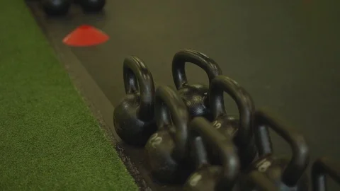 Slow pan over weights in a gym Stock Footage 73156544