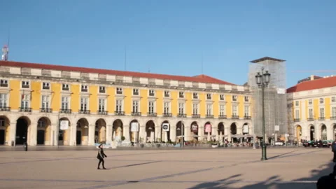 Slow pan of the 'Praca do Comercio' square in Lisbon at sunrise Stock Footage 141430731
