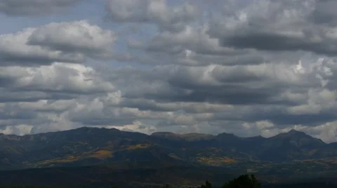 Slow Pan Right across cloudy mountain range, 4K Stock Footage 56466305