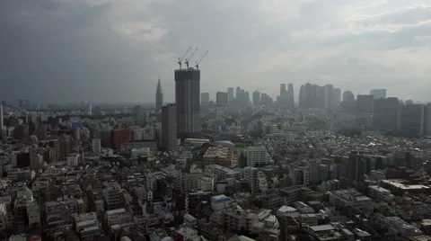 Slow pan right high elevation daytime panoramic view towards Shinjuku, Tokyo Stock Footage