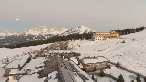 Slow Pan Right Over a Snowy Ski Lodge in Italian Alps Stock Footage 229795133
