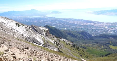 Slow pan to the right on the top of Mount Timpanogos with views of Provo and Stock Footage 120161061