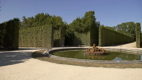 Slow pan shot of flora basin in gardens of Versailles 動画素材 117373472