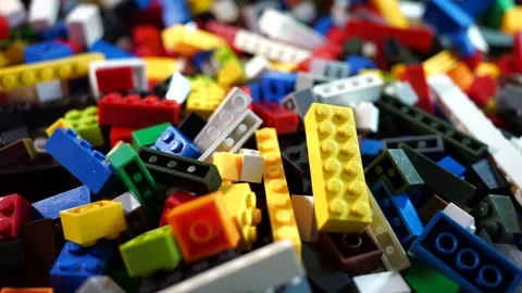 Slow pan shot over a  stack of colorful Lego bricks . Stock Footage 313375347