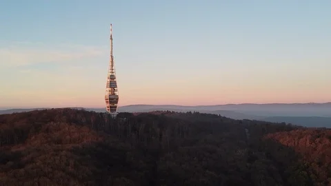 A slow pan-up shot of a signal/tv tower on a winter day. Stock Footage