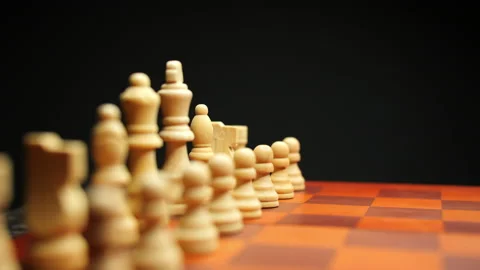 Slow Pan Shot of White Chess Pieces on Chessboard Stock Footage 236948220