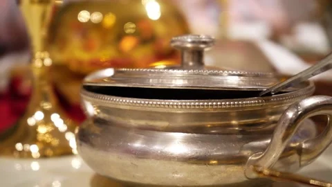 Slow pan showing an elegant covered pot made of silver with golden elements all Stock Footage 159978708
