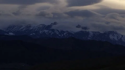 Slow pan of Snowy Mountain range in fog Stock Footage 37344399
