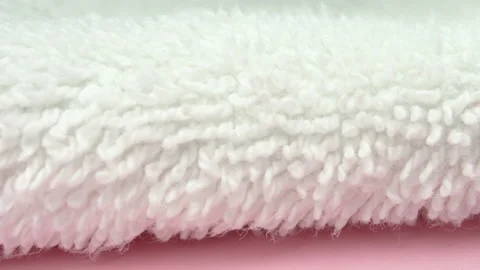 Slow pan on surface of white bath towel 4K macro detail Stock Footage 155277772