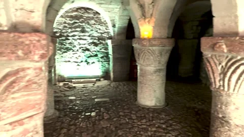 Slow Pan Through 11th Century Norman Romanesque Crypt with Carved Stone Pillars Stock Footage 324843531