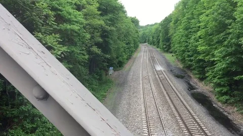 Slow pan to train tracks from bridge POV Stock Footage 78505671