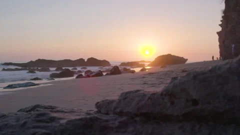 Slow pan of waves at sunset, Thousand Steps Beach Stock Footage 174875216