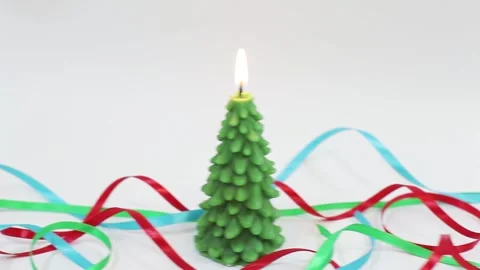 Slow panning from left to right of burning candle Stock Footage 143660178