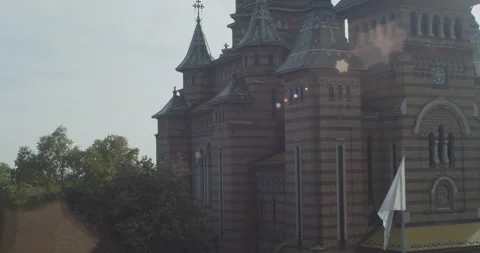 Slow panning on parc and cathedral in Timisoara 4K footage Stockbeeldmateriaal 284487187