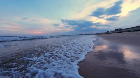 Slow panning shot of a beautiful beach sunrise with copy space Stock Footage 342330730