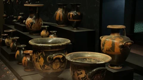 Slow panning shot showcasing the collection of Greek pottery and terracotta Stock Footage 340154989
