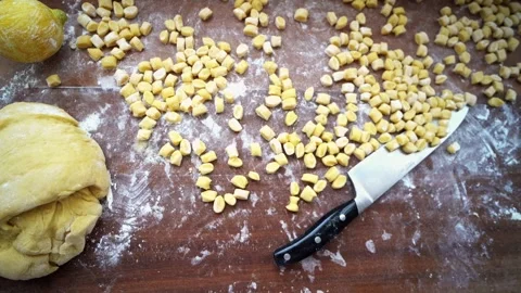 Slow panning of struffoli and lemon on wooden board 스톡 동영상 276673371