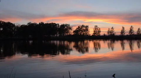 Slow panning sunset at lake Stock Footage 56296975