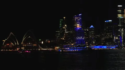 Slow panning of Sydney CBD waterfront across harbour at Vivid Sydney in 4k. Stock Footage 310912870